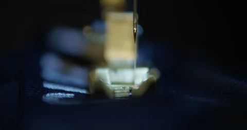 Sewing machine sewing blue fabric Stock Footage 108798645