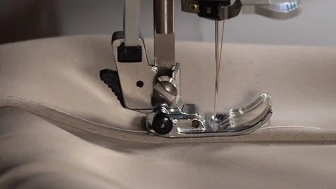 Sewing machine slow stitching. Sewing machine needle slow moving up and down. 4K Stock Footage 129569857