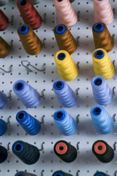 Sewing machine spools with colorful threads Stock Photos