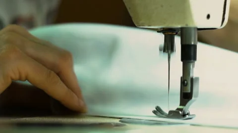Sewing machine stitches white fabric. Close-up of sewing fabric. A big part of Stock Footage 87178958