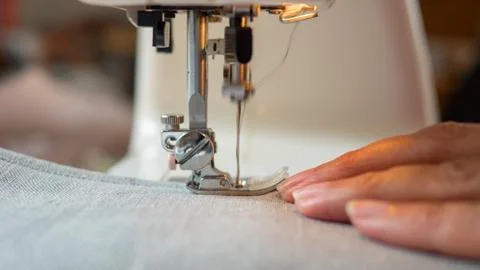 Sewing machine stitching fabic Stock Photos