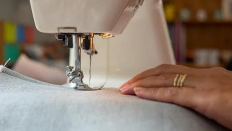Sewing machine stitching fabic Stock Photos