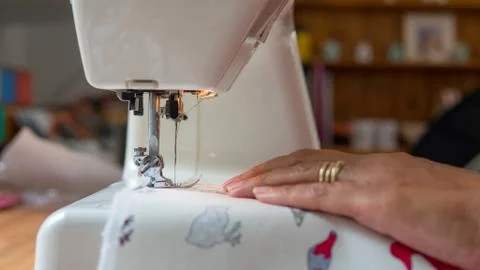 Sewing machine stitching fabic Stock Photos