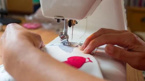Sewing machine stitching fabic Stock Photos