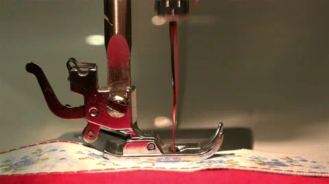 Sewing machine stitching on the fabric performs threading her needle and thread Stock Footage 67846929