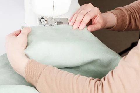 Sewing machine, stitching fabrics, needle in a round plan Stock Photos