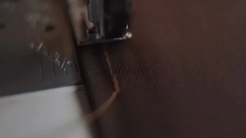 Sewing machine stitching thick thread on fabric macro Stock Footage 195957322