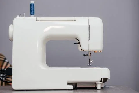 Sewing machine on a table in a sewing workshop Stock Photos