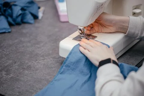 Sewing machine on a table in a sewing workshop Stock Photos