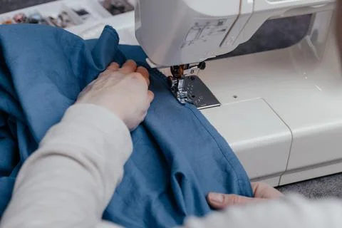 Sewing machine on a table in a sewing workshop Stock Photos