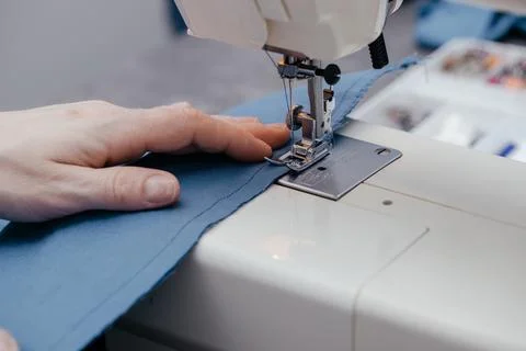 Sewing machine on a table in a sewing workshop Stock Photos