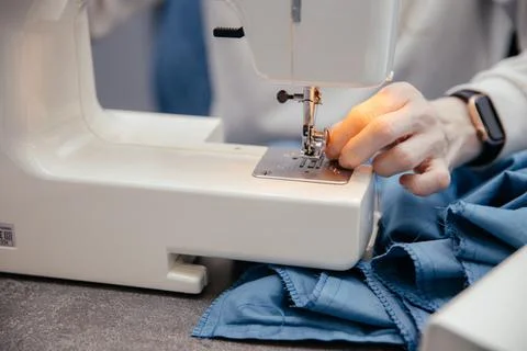 Sewing machine on a table in a sewing workshop Stock Photos