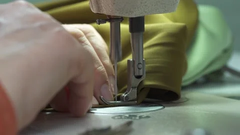 Sewing machine. Tailoring at a textile factory Stock Footage 234651355