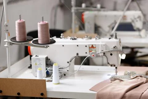 Sewing machine with thread skees at the factory 스톡 사진