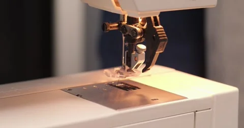 Sewing machine using at home 4K tilting video Stock Footage 298630256