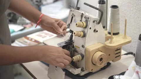 Sewing machine with vintage look. Process of sewing in atelier or workshop. Stock Footage 137679744