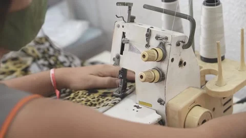 Sewing machine with vintage look. Process of sewing in atelier or workshop. Stock Footage 137679757
