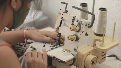 Sewing machine with vintage look. Process of sewing in atelier or workshop. Stock Footage 137679762