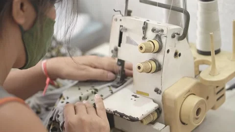 Sewing machine with vintage look. Process of sewing in atelier or workshop. Stock Footage 137679763