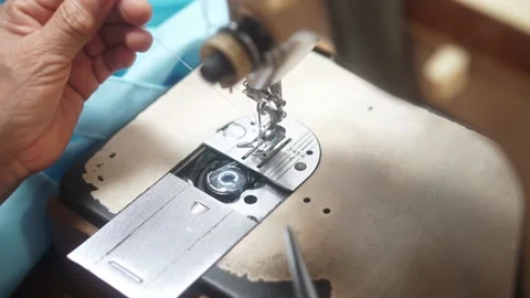 Sewing machine with vintage look. Process of sewing in atelier or workshop. Stock Footage 154280824