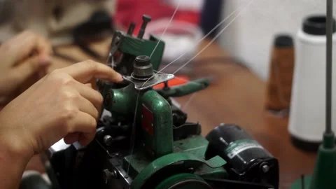 Sewing machine with vintage look. Process of sewing in atelier or workshop. Stock Footage 154521381