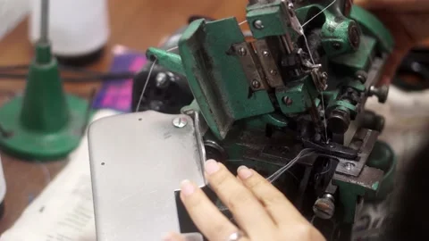 Sewing machine with vintage look. Process of sewing in atelier or workshop Stock Footage 154521383