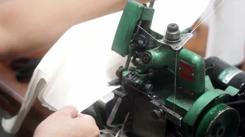 Sewing machine with vintage look. Process of sewing in atelier or workshop. Stock Footage 154521393