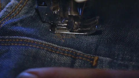 Sewing machine working on denim fabric Stock Footage 114712057