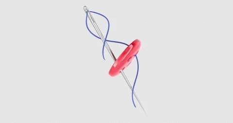 Sewing needle with a blue thread passing through a red four-hole button, ro.. Stock Footage 320141137