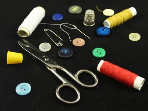 Sewing Needle thread scissors thimble tailor buttons Stock Photos