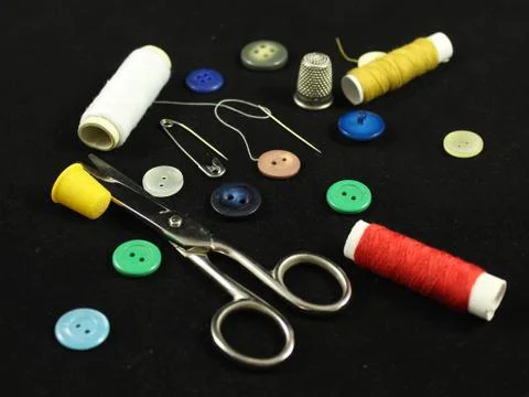 Sewing Needle thread scissors thimble tailor buttons Stock Photos