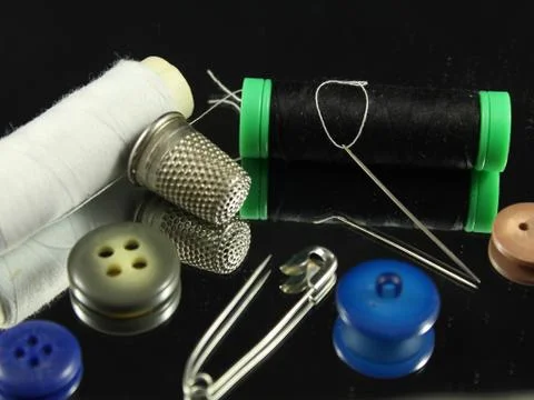 Sewing Needle thread scissors thimble tailor buttons Stock Photos
