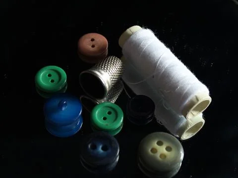 Sewing Needle thread scissors thimble tailor buttons Stock Photos