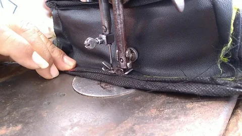 Sewing with an old sewing machine Stock Footage 119627606