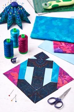 Sewing patchwork of block anchor surrounded by accessories Fotos de archivo