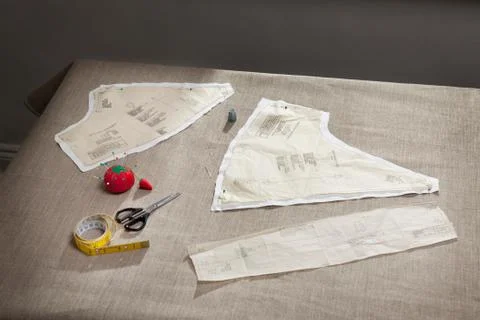 Sewing pattern, pin cushion and tape Stock Photos