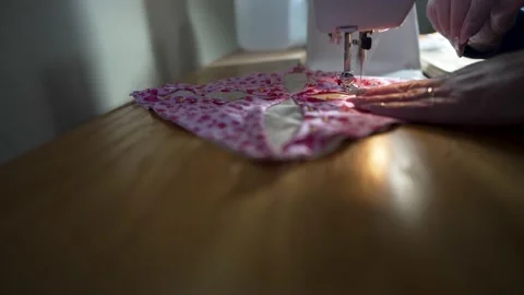 Sewing the pattern on a quilt block with a sewing machine - side view Stock Footage 167623243