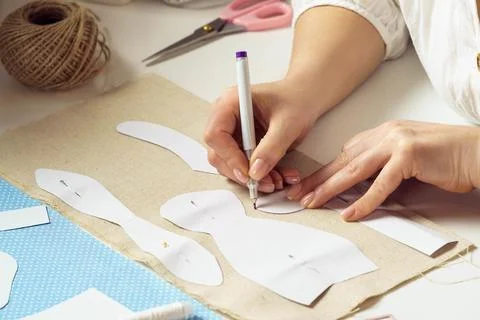 Sewing patterns for future toy or clothes. Cropped designer, seamstress pin Stock Photos