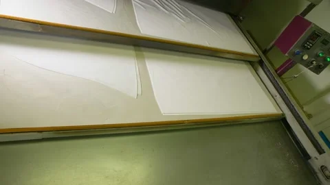 Sewing patterns for hockey uniform transported by machine Stock Footage 143028763