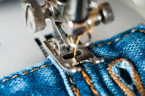 Sewing process denim material Stock Photos