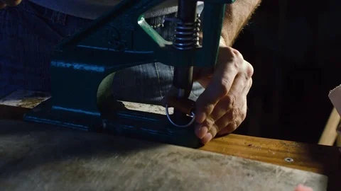 Sewing process of the leather belt. Man's hands behind sewing Stock Footage 71390255
