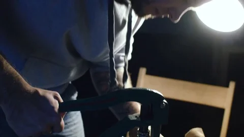 Sewing process of the leather belt. Man's hands behind sewing Stock Footage 71390549
