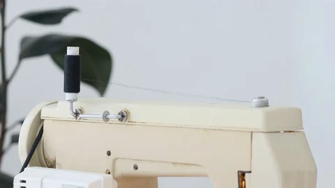 Sewing process. sewing machine at home in the workplace on a white background Stock Footage 129135661