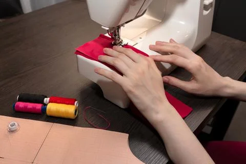 Sewing process on a sewing machine. Sewing accessories threads, graph paper Stock Photos