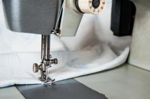 Sewing process white material Stock Photos