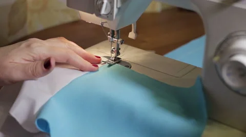 Sewing Process - Women's hands behind her sewing Video stock 55935195