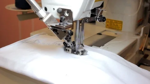 Sewing Process - Women's hands behind her sewing Stock Footage 99937319