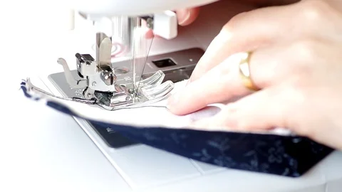 Sewing protective mask on the sewing machine Stock Footage 127241084