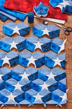 Sewing of quilt with stylized elements of American flag 스톡 사진