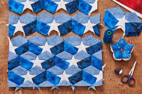 Sewing of quilt with stylized elements of American flag Stock Photos